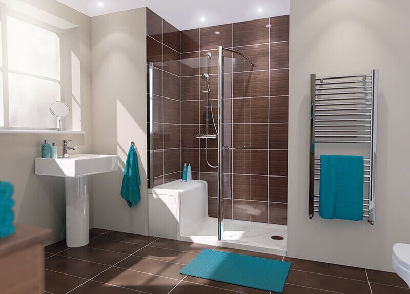 Modern bathroom with brown tile shower, glass door, white sink, heated towel rail, and teal towels and mat. Natural light enters through a window, highlighting the clean, contemporary design.