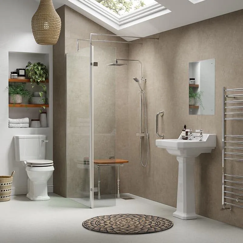 Modern bathroom with a walk-in shower featuring a glass door and wooden bench, a white toilet, pedestal sink, wall mirror, open shelves with plants, heated towel rail, and a round patterned rug under a skylight.