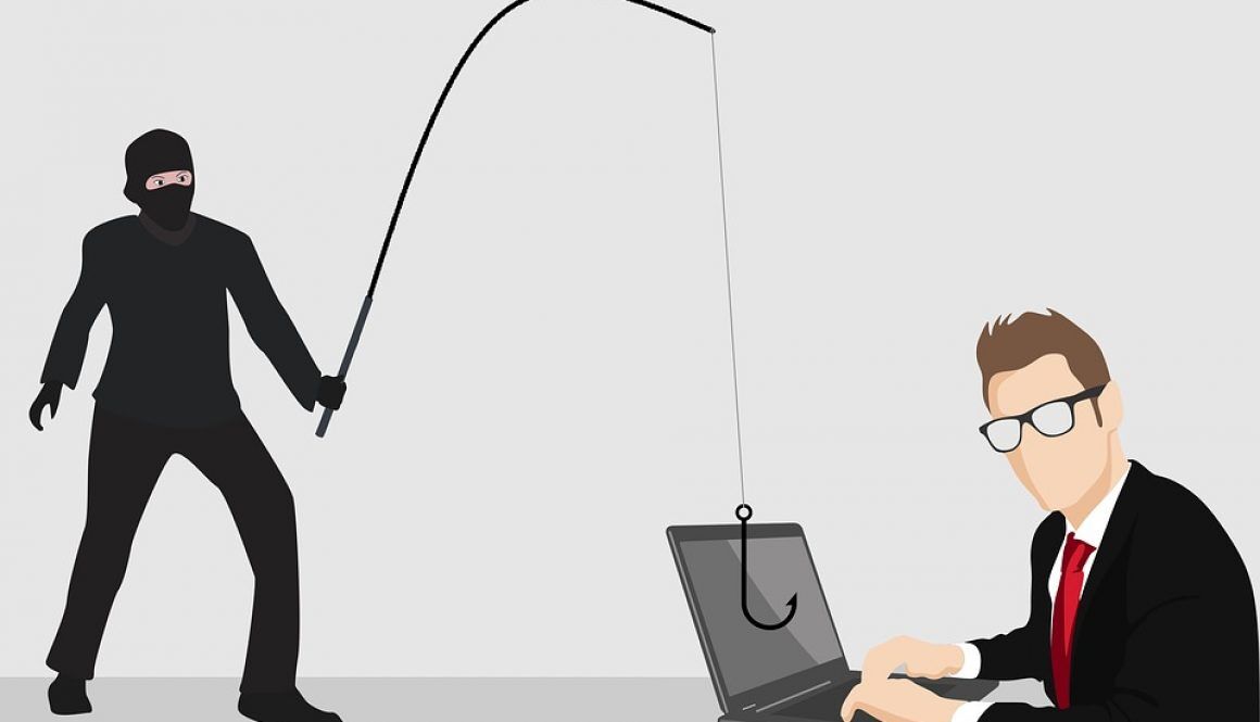 A masked person in black holds a fishing rod with a hook aimed at a laptop, while a person in a suit and glasses types on the laptop, symbolizing a phishing cyberattack.
