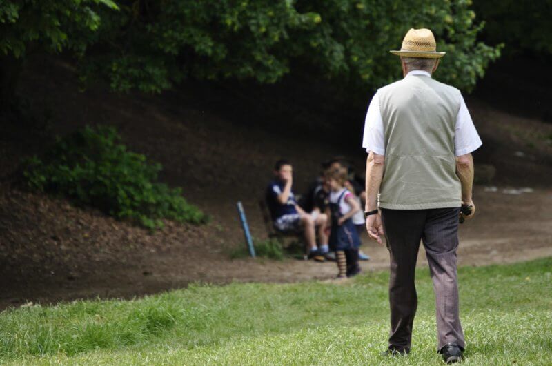 Old man walking towards grand childrens