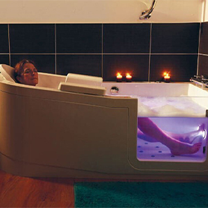 Lady enjoying resonance sound therapy during her bath.