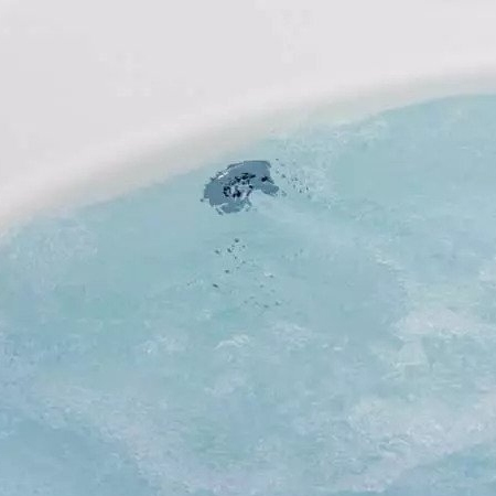 Water in bathtub.