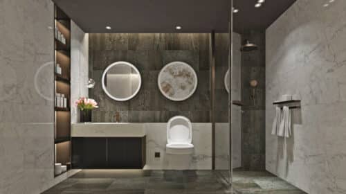 A modern bathroom with a walk in shower enclosure and free standing bath