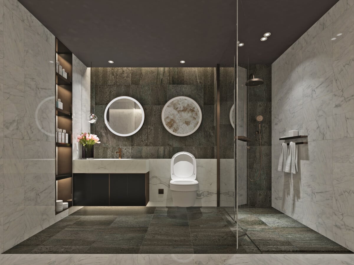 A modern bathroom with a walk in shower enclosure and free standing bath