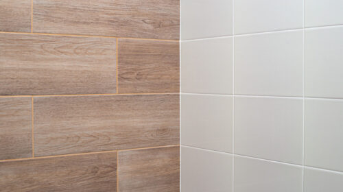 Wall tiles with light wood texture and white.