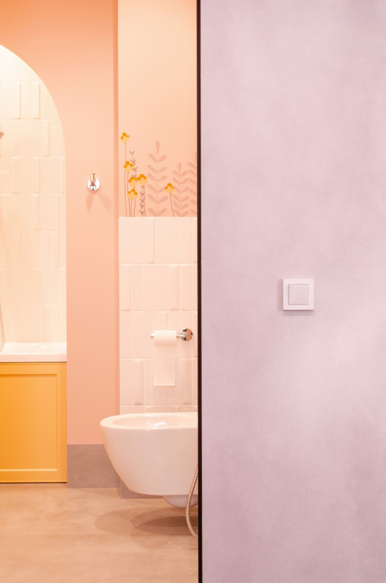A pastel pink and orange bathroom 