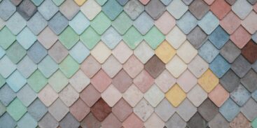 Pastel coloured tiles in blues, pinks, greens and yellows, arranged in a pattern