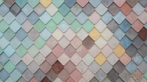 Pastel coloured tiles in blues, pinks, greens and yellows, arranged in a pattern