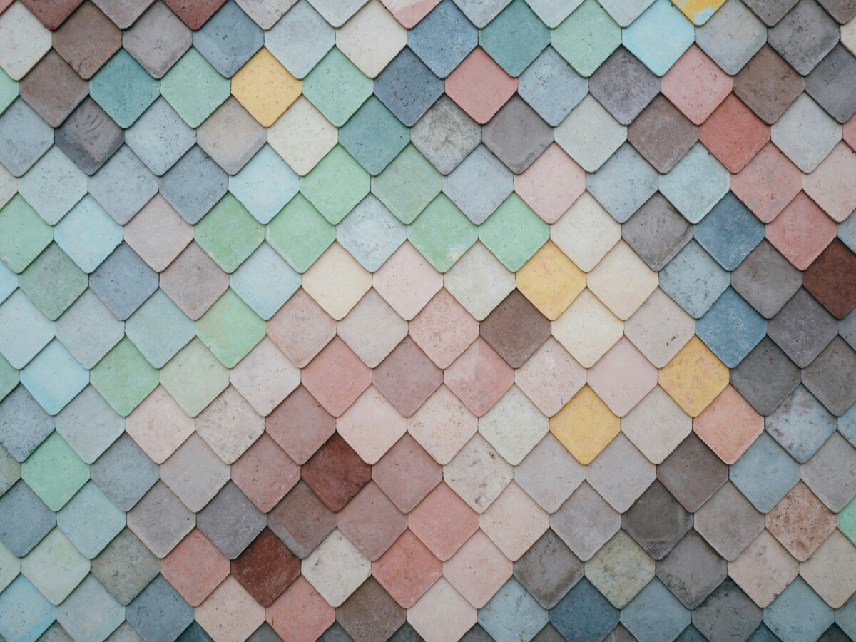 Pastel coloured tiles in blues, pinks, greens and yellows, arranged in a pattern